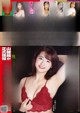 a japanese woman in a red bra top is posing for the camera